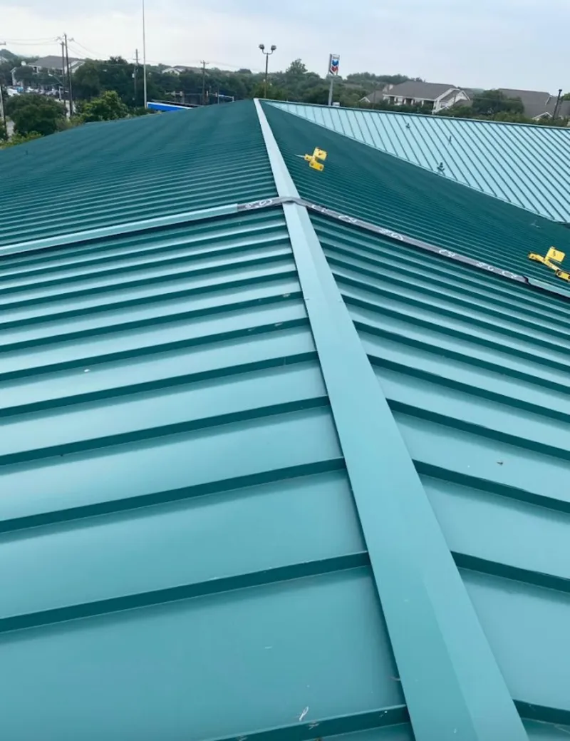 Green commercial metal roof ridge and valley for Metal Roof Repair in Suffolk